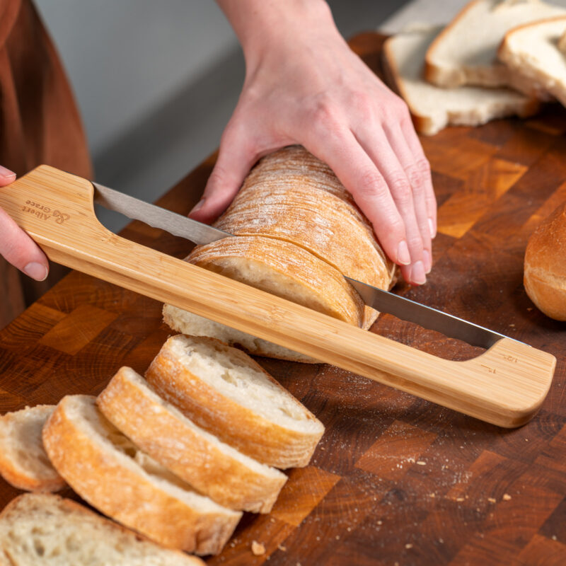 bread bow knife cutting baguette