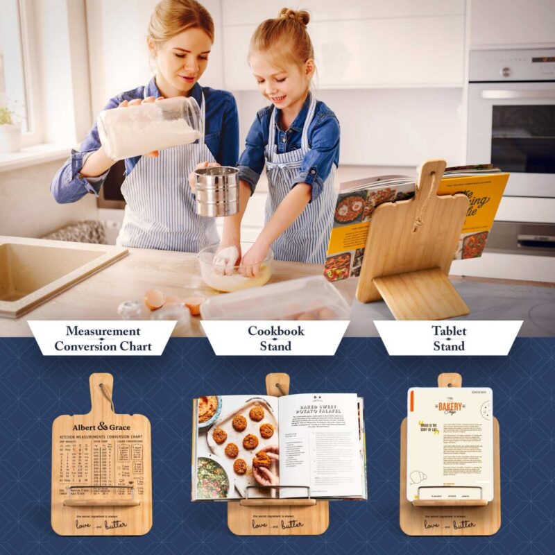 womand and daugther baking while cookbook holder with recipe book is on table