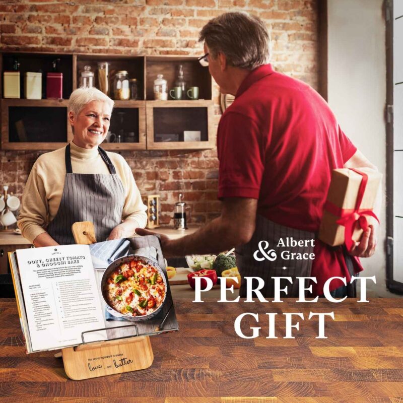 man gifting cookbook holder to his wife